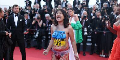 Cannes 2022: une femme fait irruption sur le tapis rouge pour dénoncer les viols en Ukraine