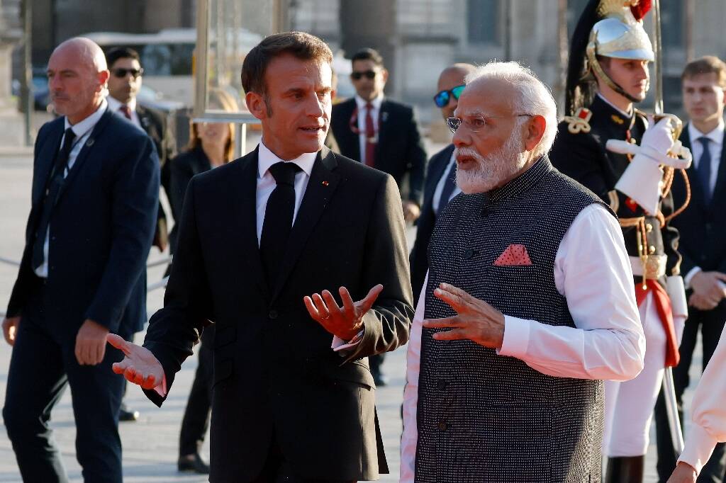 Why did Emmanuel Macron go to India?