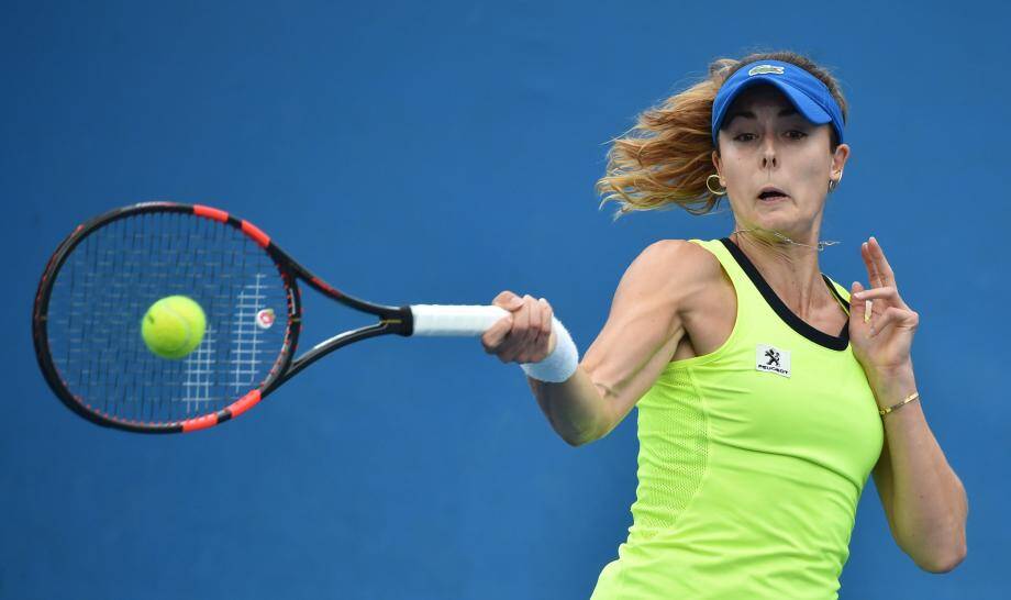 France's Alize Cornet plays a forehand return during her women's singles match against Serbia's Bojana Jovanovski on day two of the 2016 Australian Open tennis tournament in Melbourne on January 19, 2016. AFP PHOTO / PETER PARKS-- IMAGE RESTRICTED TO EDITORIAL USE - STRICTLY NO COMMERCIAL USE TENNIS-AUS-OPEN