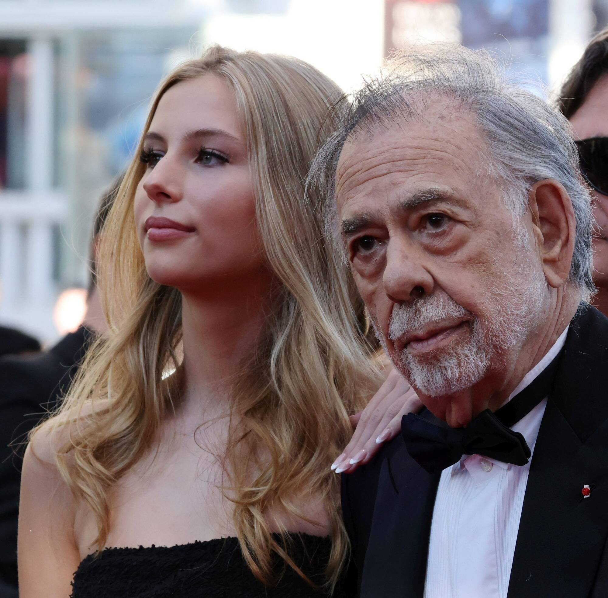 77e Festival de Cannes: qui était la jeune femme aux côtés de Francis Ford Coppola sur le tapis rouge jeudi soir?