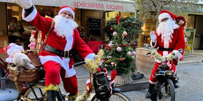 Sur leur solex, deux pères Noël distribuent des cadeaux et de la bonne humeur dans les rues de Menton