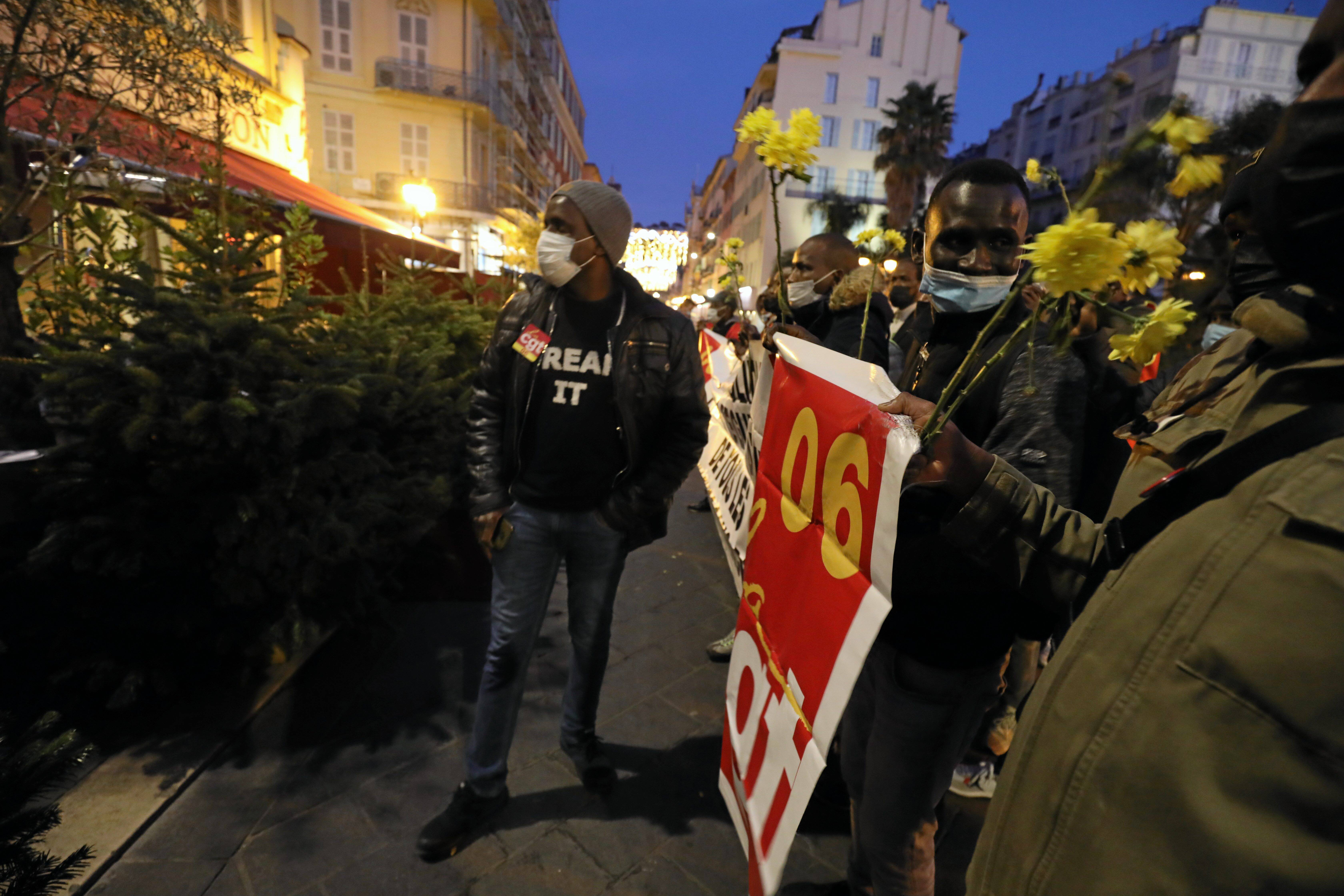 Undocumented workers demonstrate in front of a prominent restaurant in Old Nice to demand documents